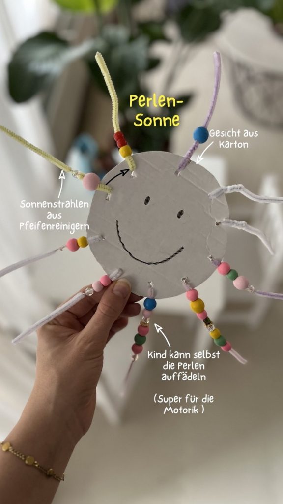 Bunte Perlensonne mit Kleinkind gestaltet.